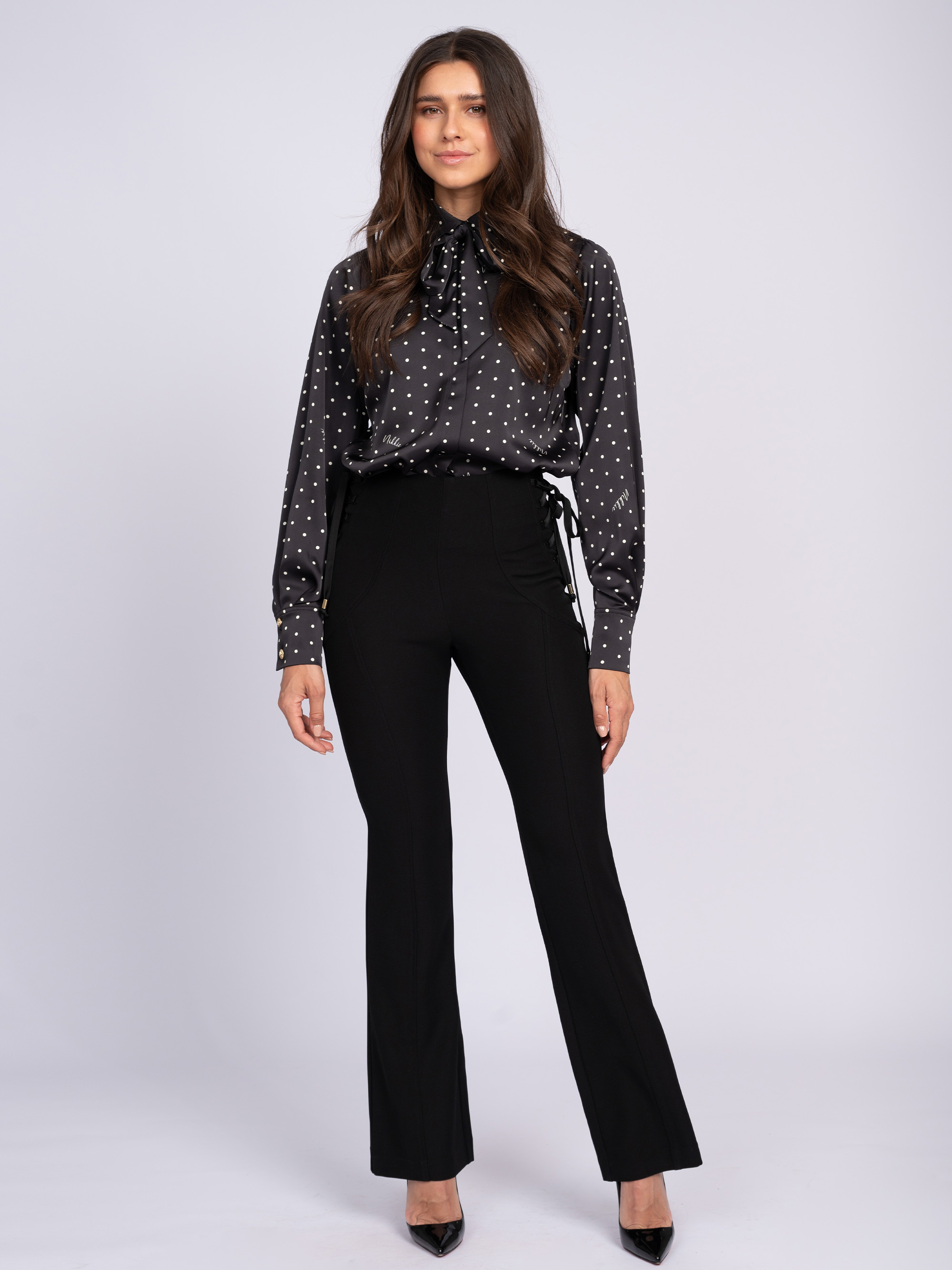 Fitted flared pants with lace-up details